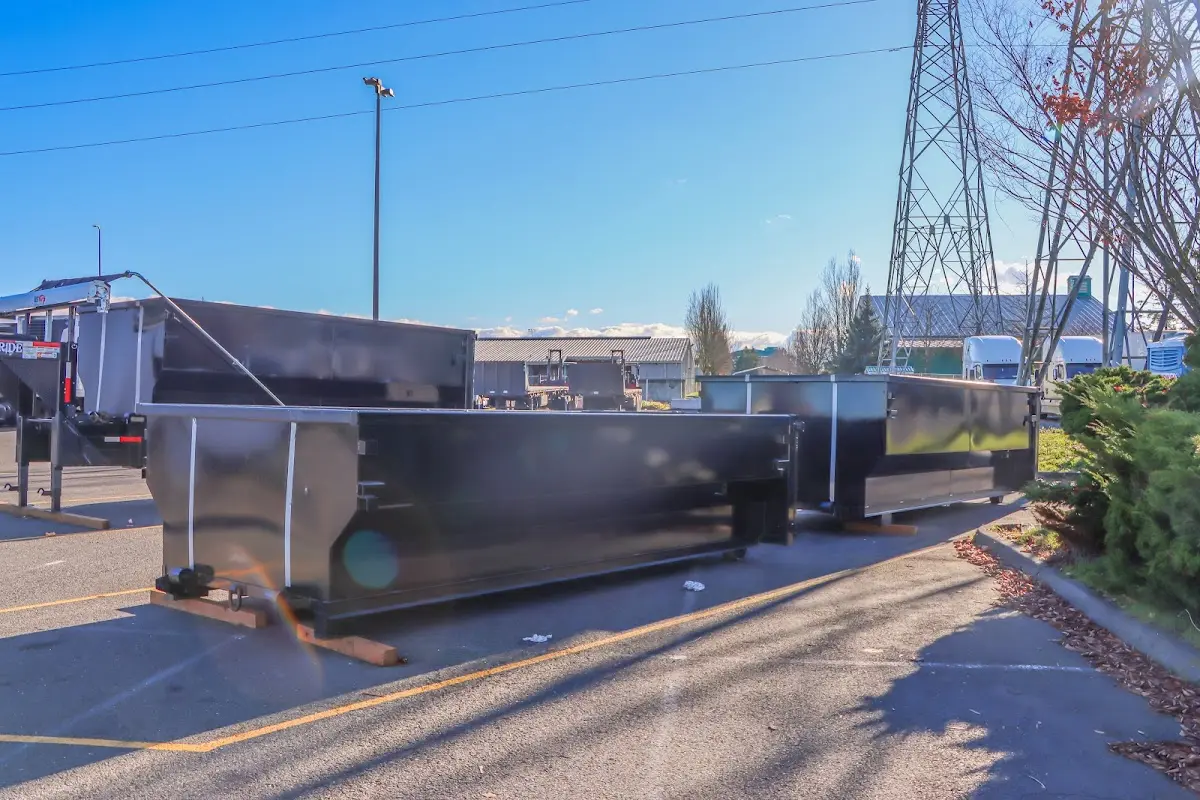 Roll-off dumpster ready for waste disposal at job site for 3 Yard Dumpster Rental in Holly Springs